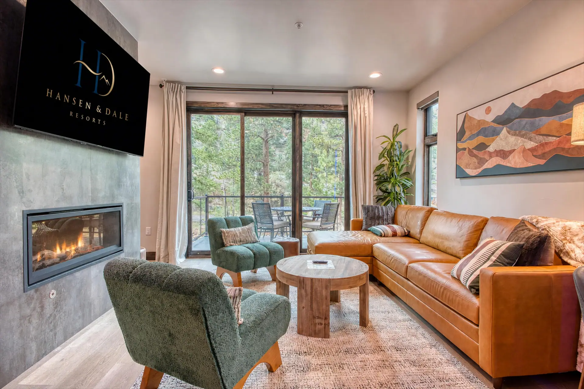 DreamView living room with a fireplace and balcony